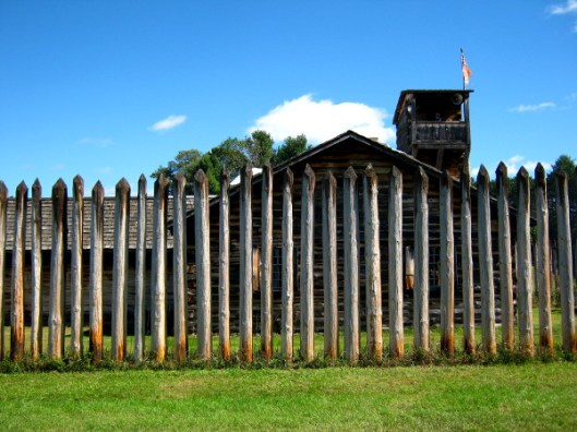 The Fort at No. 4’s perimeter fence consisted of stockade poles that were too tall to climb over, too close together for a man to squeeze through but too far apart to offer cover from the men shooting from the roofs of the buildings inside.